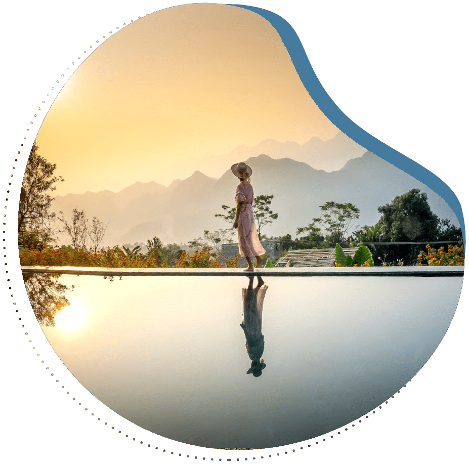 A woman standing on the edge of a pool.